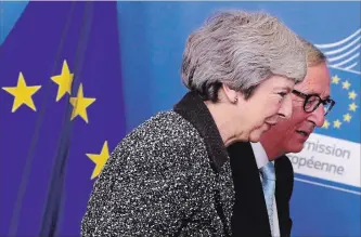  ?? FRANCISCO SECO
THE ASSOCIATED PRESS ?? British Prime Minister Theresa May goes into a meeting with European Commission President Jean-Claude Juncker in Brussels on Tuesday. May met with European leaders looking for flexibilit­y on the Brexit deal.