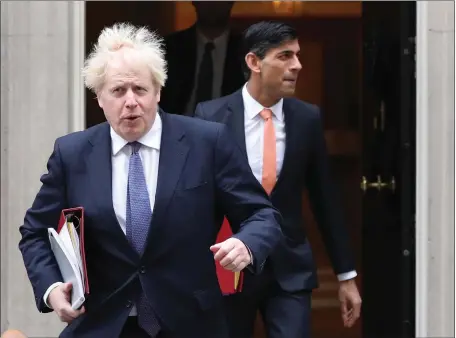  ??  ?? Both Boris Johnson, left, and Rishi Sunak initially planned not to self-isolate despite being pinged by NHS Test and Trace after Sajid Javid, inset, tested positive for Covid on Saturday. However, the decision was quickly reversed following a furious backlash