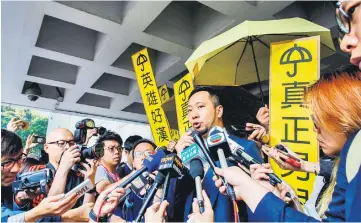  ??  ?? Tsang speaks to the press upon his arrival outside the High Court in Hong Kong before being jailed after he dropped an appeal bid. — AFP photo