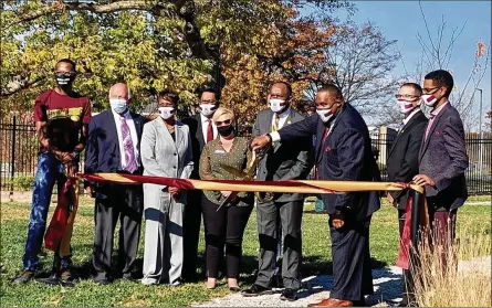  ??  ?? Central State President Jack Thomas cuts the ribbon at the grand opening of the CSU Seed to Bloom Botanical and Community Garden. Joining him were student Jorden Harris, Senator Bob Hackett, Trustee Jacqueline Gamblin, Trustee Marlon Moore, Xenia Mayor Sarah Mays, President Jack Thomas, Trustee Larry Macon, Jr., Trustees Chair Mark Hatcher, Trustee Jason Manns and Trustee Yonathan Kebede.