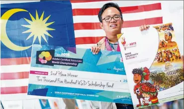  ??  ?? Ng with his winning artwork and a mock cheque.