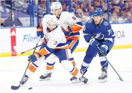  ?? USA TODAY SPORTS ?? New York Islanders defenceman Adam Pelech (3) skates with the puck as Tampa Bay Lightning left winger Ross Colton (79) defends during the third period in Game 1 of the 2021 Stanley Cup semifinals at Amalie Arena in Tampa on Sunday. New York won the series opener 2-1.