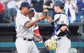  ?? Nam Y. Huh / Associated Press ?? Yankees relief pitcher Wandy Peralta, left, celebrates with catcher Kyle Higashioka after Sunday’s win over the White Sox in Chicago.