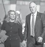  ?? FREE PRESS
JUNFU HAN, DETROIT ?? State Rep. Matt Maddock, right, walks around with his wife, Meshawn Maddock, before a Save America rally at the Michigan Stars Sports Center in Washington Township on April 2, 2022.