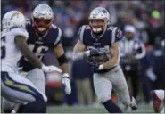  ?? CHARLES KRUPA - THE ASSOCIATED PRESS ?? New England Patriots running back Rex Burkhead runs toward the goal line for a touchdown against the Los Angeles Chargers during the first half of an NFL divisional playoff football game, Sunday, Jan. 13, 2019, in Foxborough, Mass.