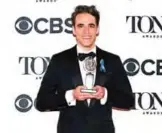  ??  ?? Steven Levenson poses in the press room with the award for best book of a musical for "Dear Evan Hansen".