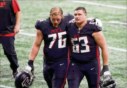  ?? JASON GETZ/AJC 2020 ?? Falcons right tackle Kaleb McGary (76) re-signed for $34.5 million over three years, and guard Chris Lindstrom earned a five-year, $105 million extension. Both players were selected in the first round of the 2019 draft. “The most important part of free agency is to sign and re-sign your own best players,” says former Falcons assistant GM Scott Pioli.