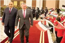  ?? Jordanian King Abdullah, on his first visit since 2008, was greeted in Baghdad by Iraqi Prime Minister Adel Abdul Mahdi and flag-waving children. ??