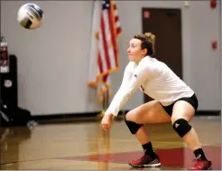  ?? Nikolas Samuels/The Signal ?? (Left) Megan Dombrowski (25) of Santa Clarita Christian School hits the ball during a home game against Lone Pine during Round 1 of the Division 5 CIF state tournament on Wednesday. (Above) Cardinal Austen Hermanson (9) gets ready to hit the ball...