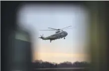  ?? The NeW YorK TiMes FiLe PhoTo ?? President Donald Trump arrives on Marine One at Dover Air Force Base in Delaware on Feb. 1 to meet with the family of a Navy SEAL killed during a U.S. military operation in Yemen.