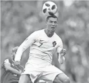  ??  ?? Portugal’s Cristiano Ronaldo leaps for a header during a match against Morocco on Wednesday in Moscow. FRANCISCO SECO/AP