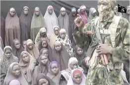  ??  ?? Video grab image taken from a video released on Youtube purportedl­y by Islamist group Boko Haram.