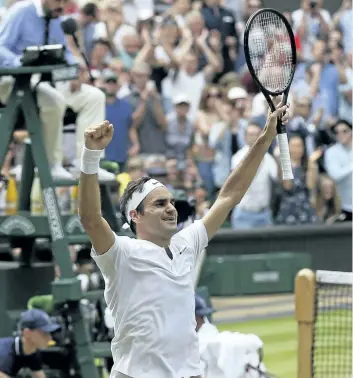  ?? TIM IRELAND/AP ?? Roger Federer celebrates after defeating Marin Cilic to win Wimbledon last month in London. Federer is back. All the way back. He’s back at the U.S. Open after sitting it out a year ago. And he’s back in the role of Grand Slam title contender after...