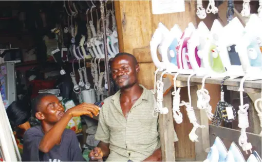  ??  ?? Obilor with his pressing iron for sale