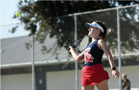  ?? RECORDER PHOTO BY NAYIRAH DOSU ?? Strathmore High School’s Taylor Simonich attempts to return the ball during the No. 3 singles match against Delano High School, Thursday, Sept. 12, 2019, at Strathmore.