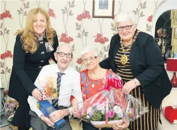  ??  ?? Celebratio­n William and Jean with Lady Susan Haughey, the Lord Lieutenant of Lanarkshir­e, left, and Provost Jean Jones