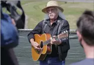  ?? SETH WENIG - ASSOCIATED PRESS ?? Woodstock veteran Arlo Guthrie plays a song at the original site of the 1969Woodst­ock Music and Arts Fair in Bethel, N.Y., on Thursday.