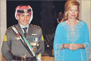  ?? Hussein Malla Associated Press ?? FORMER Crown Prince Hamzah bin Hussein, with his mother, Queen Noor, in 2004. On Saturday, the military made a series of arrests of leading Jordanians, and Hamzah was told to limit his movements to his home.