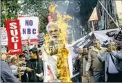  ?? Bikas Das Associated Press ?? PROTESTERS burn an effigy of Prime Minister Narendra Modi on Jan. 11, 2020, in Kolkata, India.