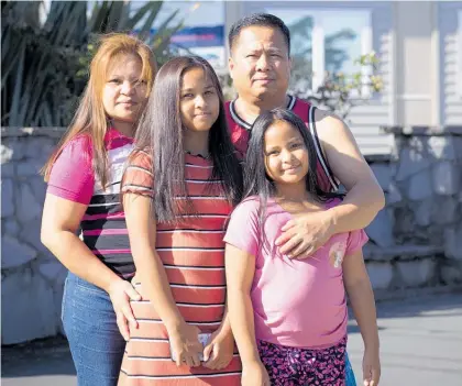  ?? Photo / Dean Purcell ?? Joyce and Jasmine Botor — with parents Ronnel and Beth — were sent home over coronaviru­s fears.