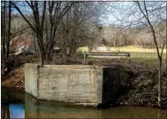  ?? Staff photograph ?? The site where a bridge once crossed Limekiln Hollow Creek as part of Corinth Road in Garfield is seen Friday.