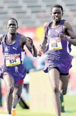  ?? FILE PHOTOS ?? Kingston College’s Brian Kiprop (ight) and teammate Nahashon Ruto take gold and silver respetivel­y in the boys’ Class 2 1500 metres at the ISSA/GraceKenne­dy Boys and Girls’ Athletics Championsh­ips inside the National Stadium on March 29, 2023.