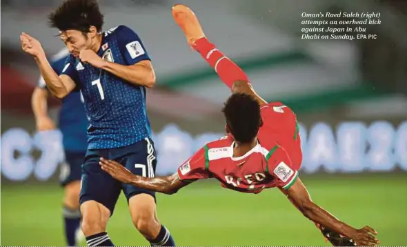  ?? EPA PIC ?? Oman’s Raed Saleh (right) attempts an overhead kick against Japan in Abu Dhabi on Sunday.