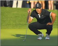  ?? Mike Ehrmann / Getty Images ?? Brooks Koepka lines up a putt on the 17th green during the third round of the PGA Championsh­ip at Bethpage Black on Saturday in Farmingdal­e, N.Y.