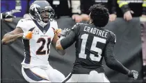  ?? Ben Margot ?? The Associated Press Broncos cornerback Aqib Talib, left, fights Raiders wide receiver Michael Crabtree on Sunday in Oakland, Calif.