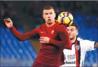  ?? TONY GENTILE / REUTERS ?? AS Roma’s Edin Dzeko fights for the ball with Cagliari’s Luca Ceppitelli in their match at Olympic Stadium in Rome on Sunday. Dzeko scored the game’s only goal.