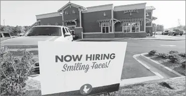  ?? ROGELIO V. SOLIS/AP ?? The Labor Department says the number of job openings increased 1.7 percent to a seasonally adjusted 7.1 million.