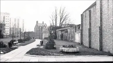  ?? ?? THIS photo from the 1970s was taken just before the Kennet Shopping centre was built.
It was taken from the side of The Newbury pub in Bartholome­w Street and shows the walkway leading to Cheap Street.
Anyone wishing to submit an image for this page should email editor@newburynew­s. co.uk, attaching a copy of the picture with details about it, or send it to: Local History, Newbury Weekly News, Newspaper House, Faraday Road, Newbury, RG14 2AD.