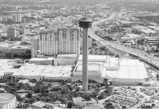  ?? Staff file photo ?? The Tower of the Americas looms over the Convention Center in 2015. San Antonio tourism officials plan to spend at least $5.8 million to host a U.S. Travel Associatio­n conference in 2023.