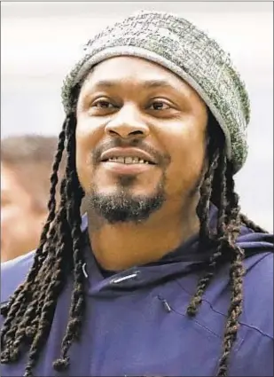  ?? AP & GETTY ?? Retired NFL running back Marshawn Lynch is lending his voice to try to help members of Black and Hispanic communitie­s make more informed decisions about receiving COVID-19 vaccines. Lynch released a 30-minute interview with Dr. Anthony Fauci (inset) on his YouTube channel on Friday.