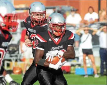  ?? GREGG SLABODA — TRENTONIAN PHOTO ?? Pennington’s Dante Wilson carries the ball against Germantown Academy.