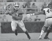  ?? John Amis /
The Associated Press ?? Georgia running back Nick Chubb (left) rushes as Appalachia­n State linebacker Anthony Flory reaches for him during Saturday’s game in Athens.