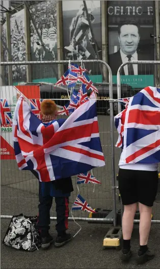  ??  ?? ENEMIES AT THE GATE: Young Rangers supporters celebrate outside Celtic