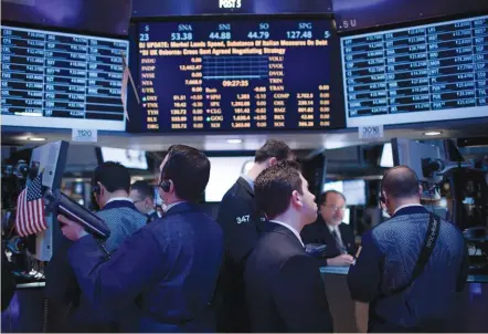  ?? (Jin Lee/bloomberg) ?? TRADERS WORK on the floor of the New York Stock Exchange yesterday. The S&P 500 has risen 89 percent since March 2009, returning 28% a year to investors including dividends as US gross domestic product expanded at an average rate of 2.4% over nine...