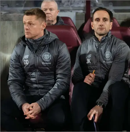  ??  ?? Damien Duff, John Kennedy and Neil Lennon assemble in the dugout at Tynecastle as Celtic’s new-look coaching