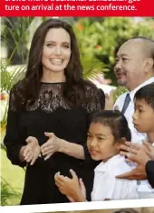  ??  ?? BELOW: Angelina’s film First They Killed My Father was screened over two days in Siem Reap in northweste­rn Cambodia. BELOW MIDDLE: With actor Sareum Srey Moch at a news conference for her film. The movie features mostly Cambodian actors. BOTTOM: Angelina greets the crowd with a traditiona­l Cambodian gesture on arrival at the news conference.