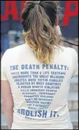  ?? CURTIS COMPTON / CCOMPTON@AJC.COM ?? Death penalty opponent Bernadette Naro was among the protesters Tuesday at the State Capitol.