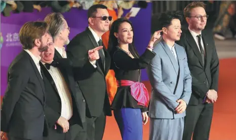  ?? JIANG DONG / CHINA DAILY ?? Jury members of the Beijing Internatio­nal Film Festival make their debut on the red carpet on Sunday. Fifteen films have been selected as finalists and await the jury’s decision.