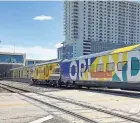  ?? ?? A Brightline trains heads to Orlando from the West Palm Beach station in September. A BOGO ticket offer is running the first week in April.