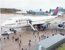  ??  ?? One of Delta’s few remaining Boeing 747s stops at the Boeing factory in Everett, Wash., on Tuesday as part of a company farewell tour. JEREMY DWYER-LINDGREN/SPECIAL FOR USA TODAY