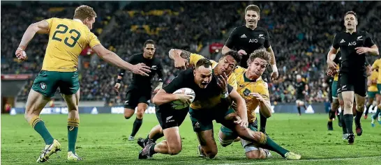  ?? PHOTO: GETTY IMAGES ?? Israel Dagg scores the second of his two tries against the Wallabies in Wellington last night.