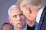  ?? AFP ?? US vice-president Mike Pence (left) and President Donald Trump talk n
during a White House briefing on Covid-19 on March 16, 2020.