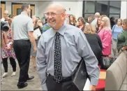  ?? Jeremy Stewart ?? Kevin Bachtel talks to colleagues and well-wishers after being named the 2022 Polk School District Teacher of the Year on Tuesday, Nov. 8, 2022.