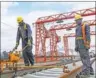  ?? PAN SIWEI / XINHUA ?? Workers at the constructi­on site of the Mombasa-Nairobi standard gauge railway in Kenya.