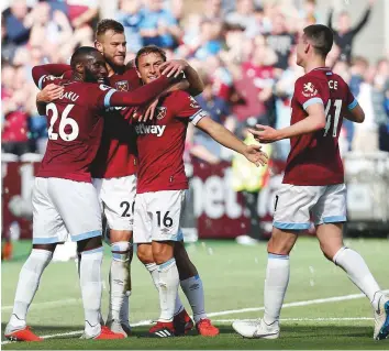  ?? AFP ?? From left: West Ham’s Arthur Masuaku, Andriy Yarmolenko, Mark Noble and Declan Rice celebrate after Manchester United’s Victor Lindelof scored an own goal yesterday.