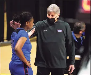  ?? David Butler II / Associated Press ?? DePaul coach Doug Bruno talks with guard Darrione Rogers during the first half against UConn on Tuesday.